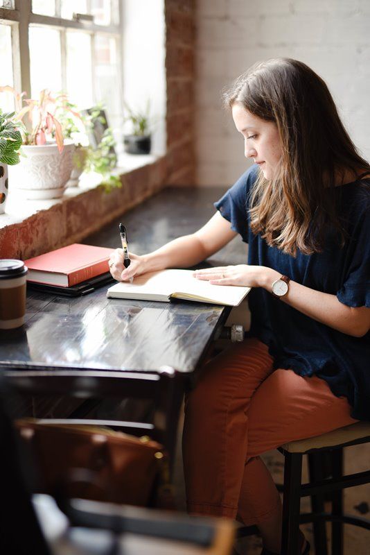 woman writing compressor